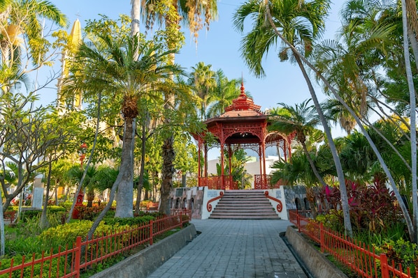 El Zócalo near Secrets Huatulco Resort & Spa with lush gardens, gazebo, and historic town square atmosphere