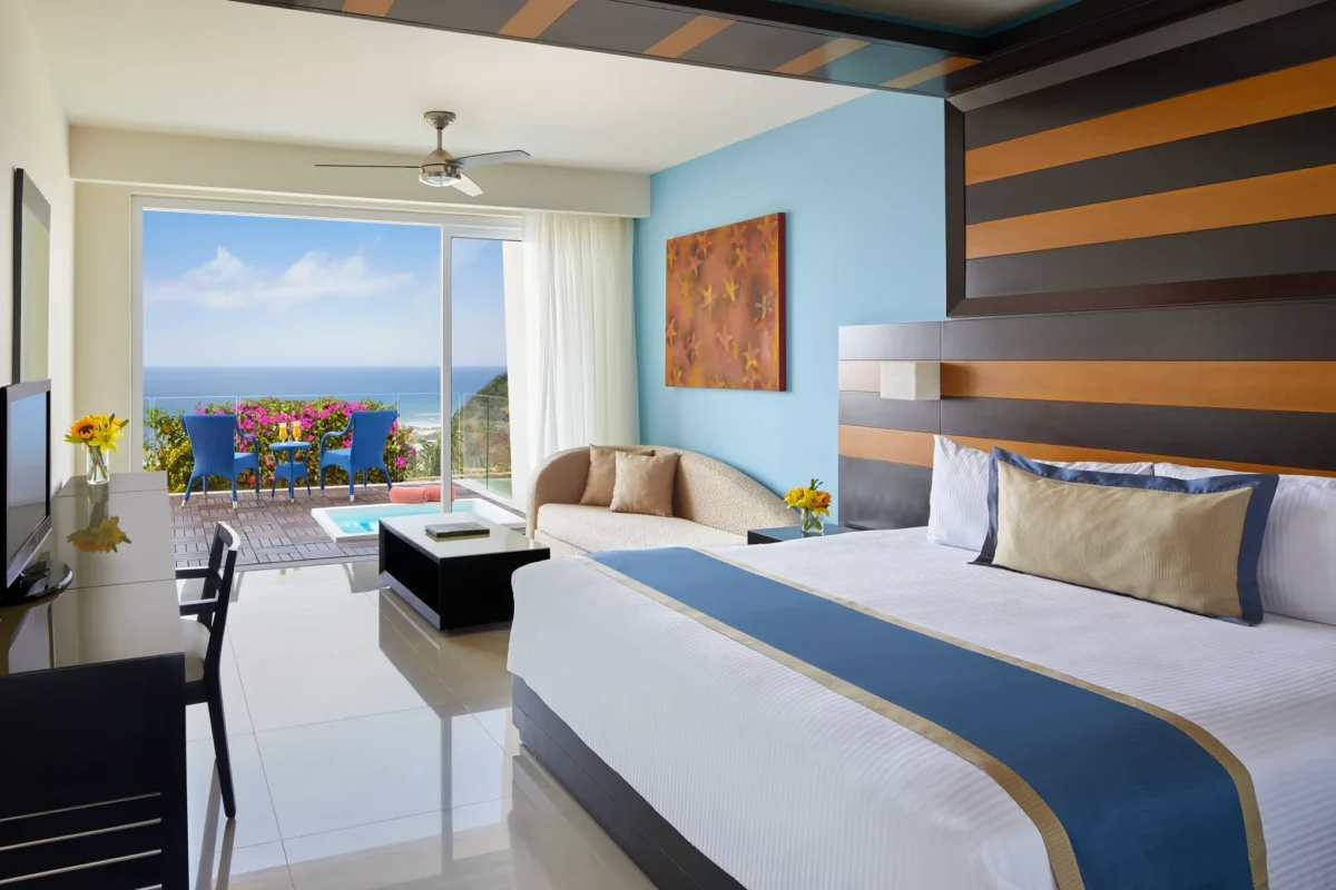 Junior Suite with Hot Tub featuring king bed and ocean view at Secrets Huatulco Resort & Spa.