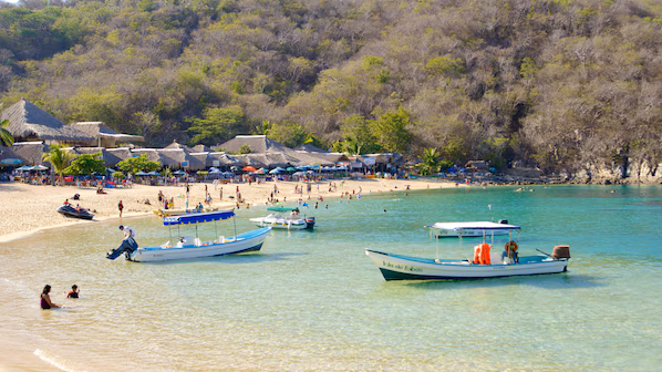 La Entrega Beach near Secrets Huatulco Resort & Spa with calm turquoise waters and snorkeling-friendly shoreline