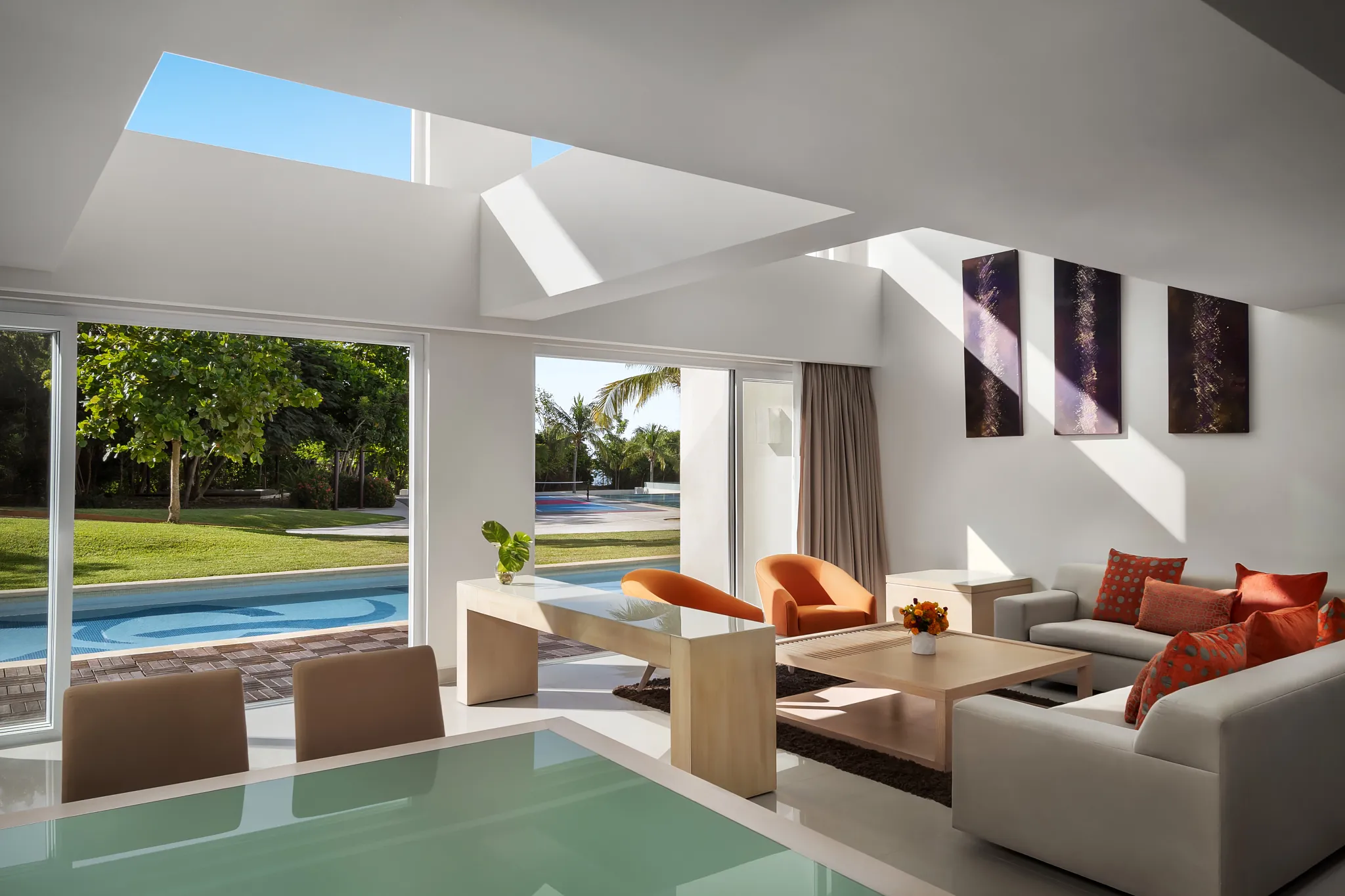 Preferred Club Two-Level Presidential Suite Swim Out living room with modern décor at Secrets Huatulco Resort & Spa.