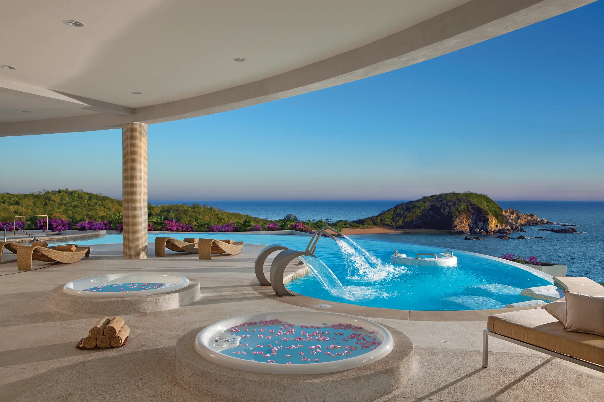 Hydrotherapy spa circuit pools with ocean views at Secrets Huatulco Resort & Spa in Mexico.